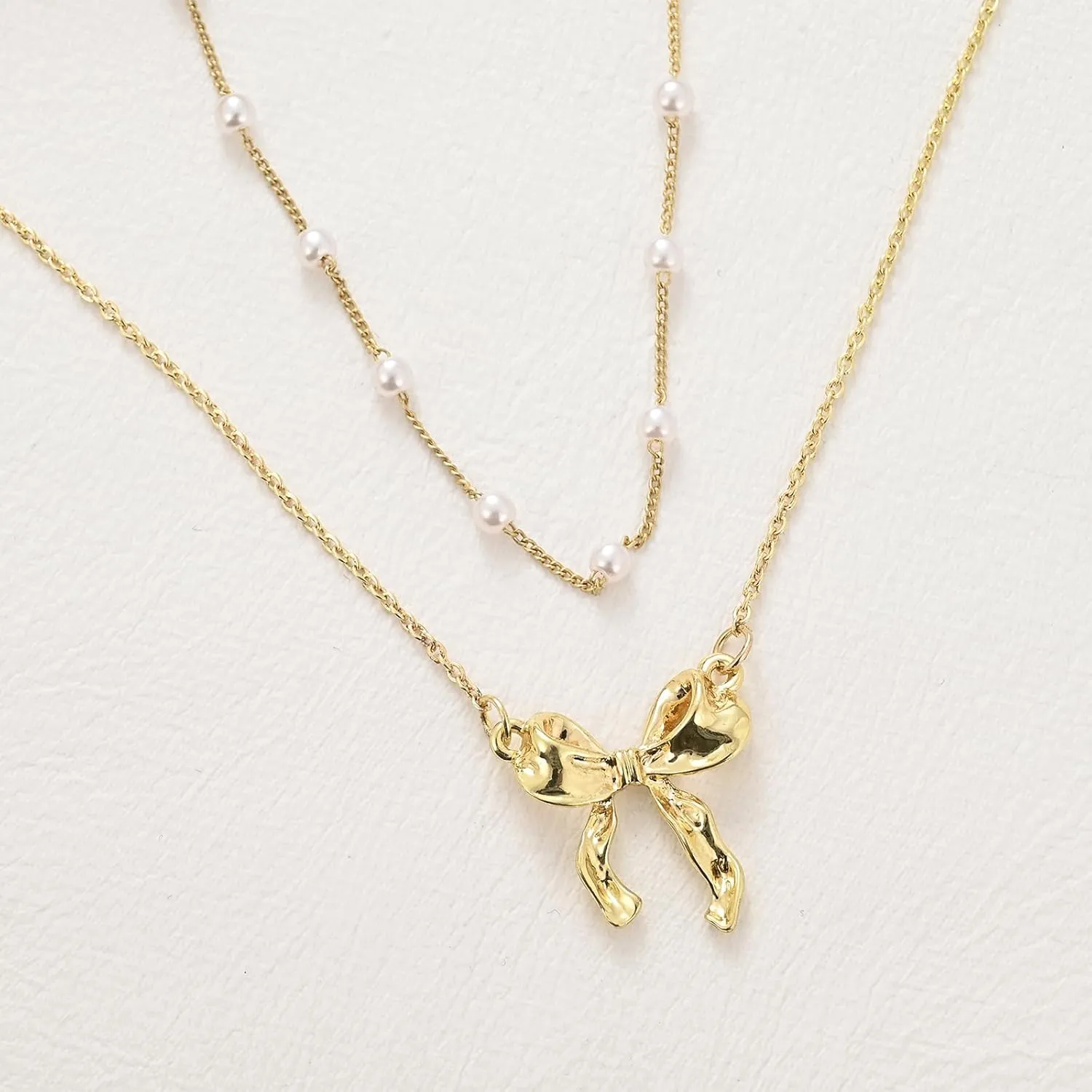 Layered Gold Necklace for Women Multilaye Gold Bow Necklace Pearl Necklace 14K Gold Plated Bow Necklaces Layered Choker Chain Necklace Cute Bow Pendant Trendy Necklaces for Women Gold Jewelry Gift.